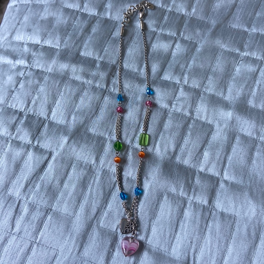 Silver with colored beads and heart charm. Very pretty 17 -18 drop inch length